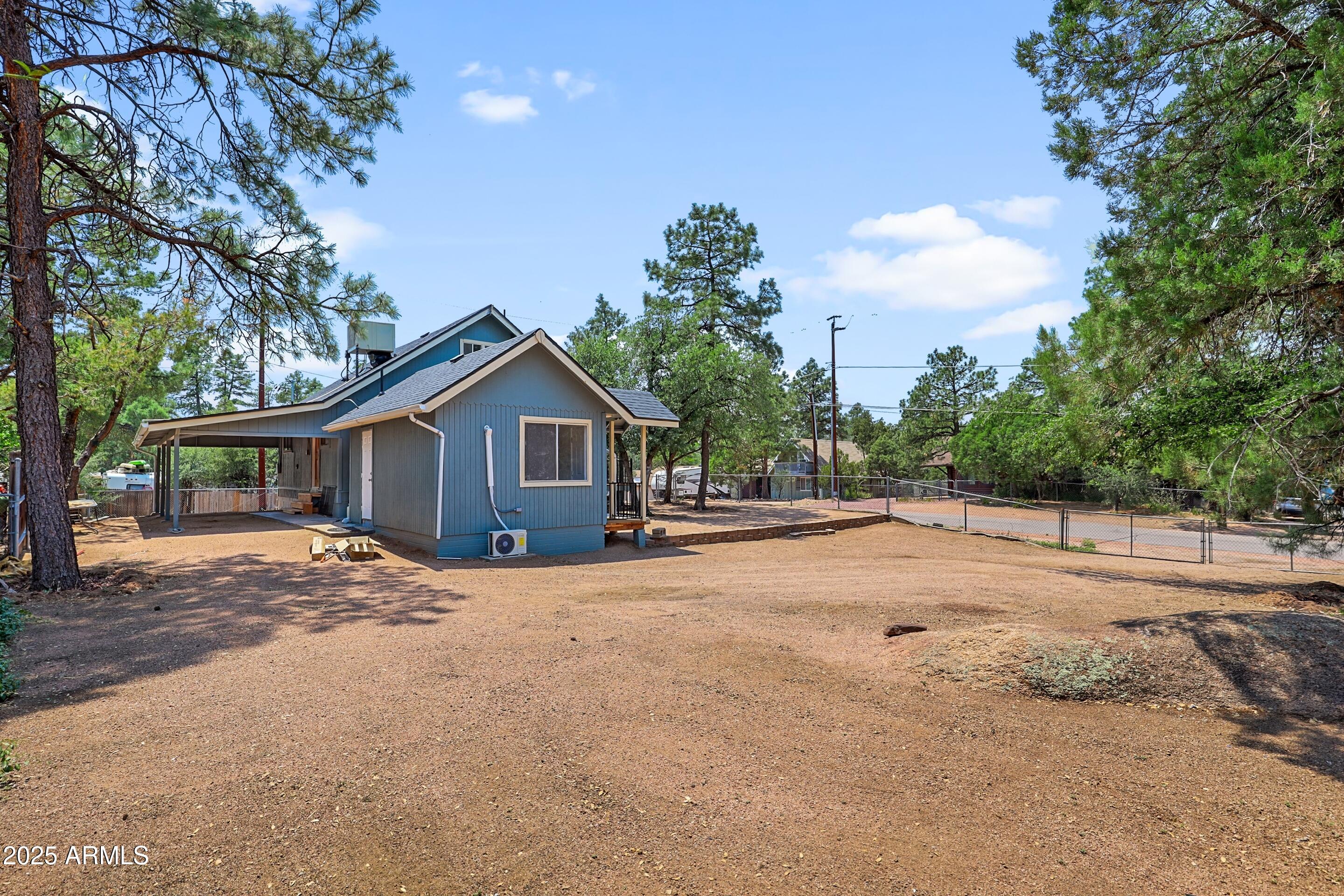 809 North Colcord Road Payson, AZ 85541 - Photo 6 of 34 a view of house with yard and trees in the background