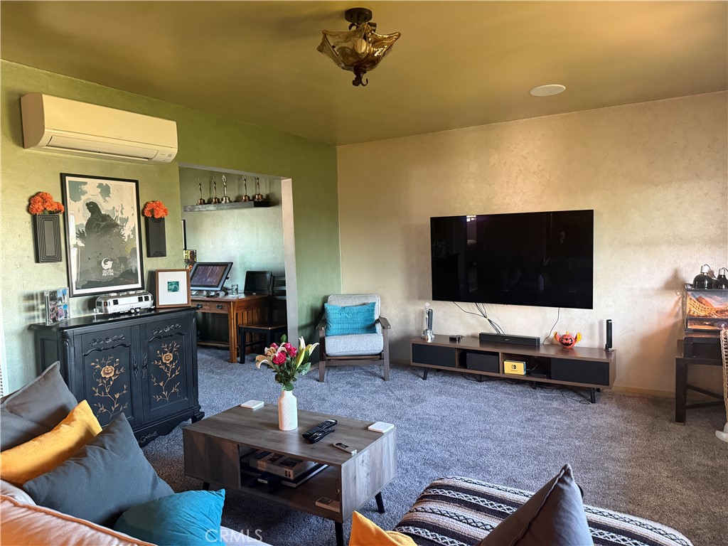 728 West 11th Street San Pedro, CA 90731 - Photo 5 of 13 a living room with furniture and a flat screen tv