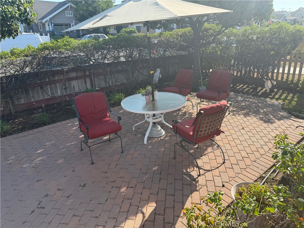 728 West 11th Street San Pedro, CA 90731 - Photo 9 of 13 a backyard of a house with table and chairs