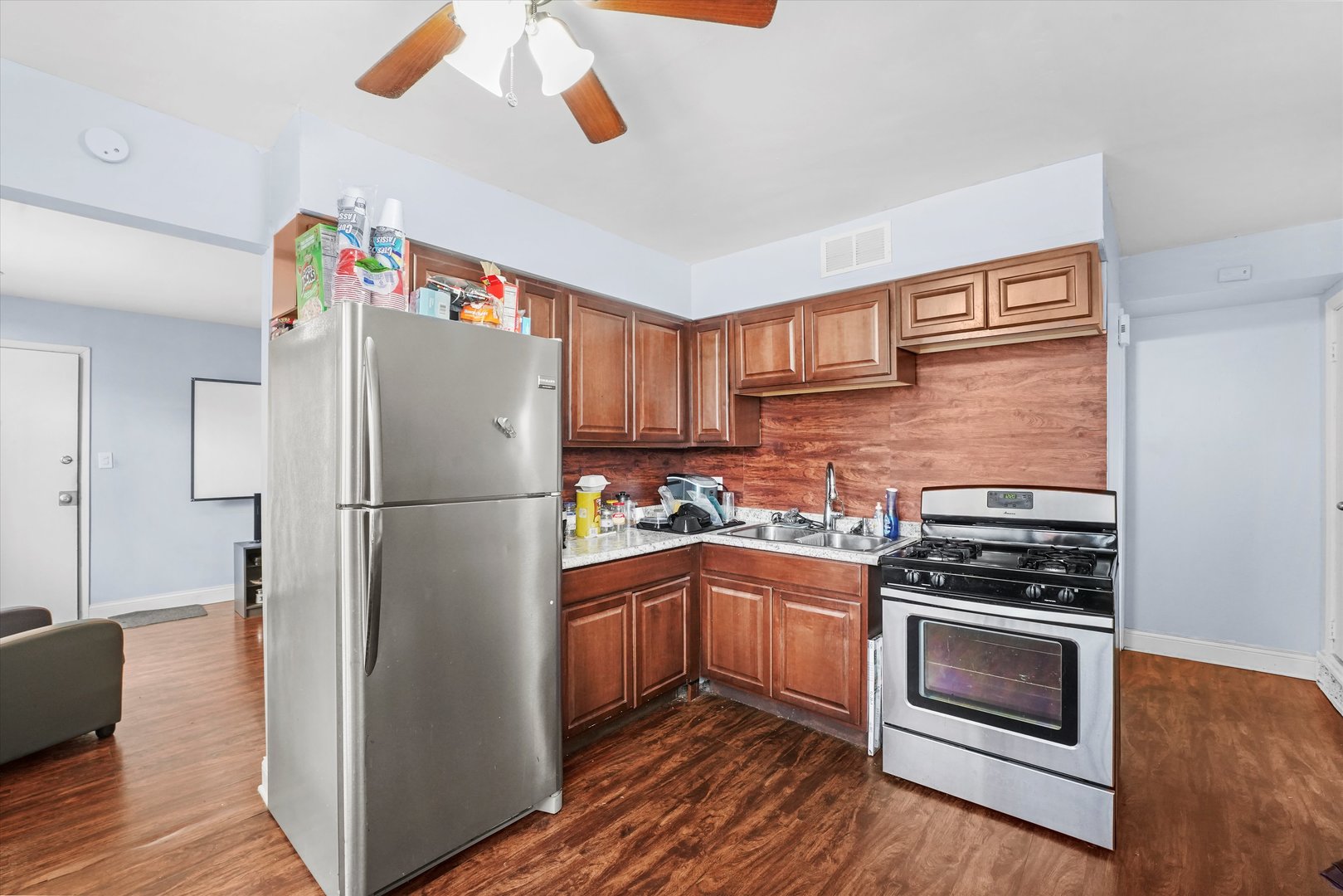 8119 South Paulina Street Chicago, IL 60620 - Photo 4 of 19 a kitchen with a refrigerator and a stove