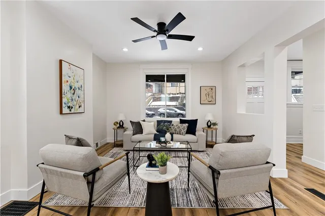 a living room with furniture and a rug