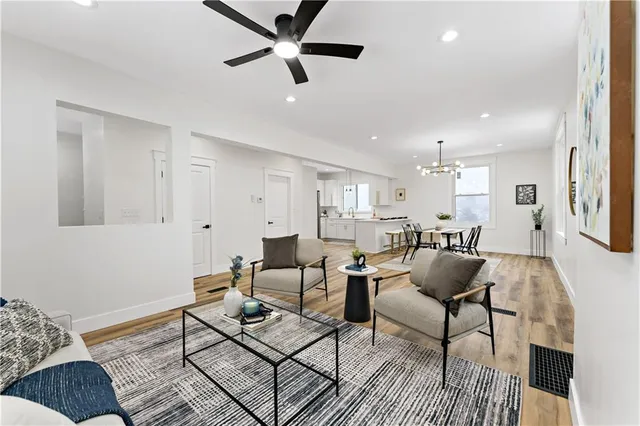 a kitchen with a sink appliances and cabinets