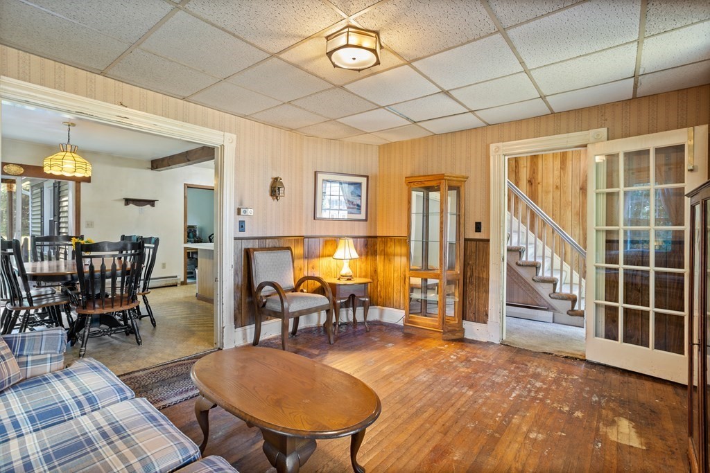 188 Dunstable Road North Chelmsford, MA 01863 - Photo 3 of 27 a living room with furniture a dining table and chairs with wooden floor