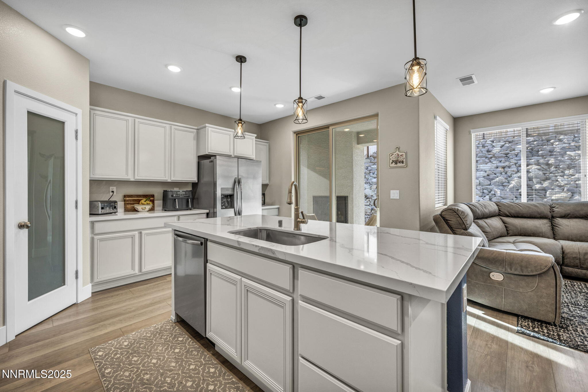 32 Stellar Court Carson City, NV 89705 - Photo 12 of 49 a kitchen with stainless steel appliances granite countertop a sink a stove and a refrigerator
