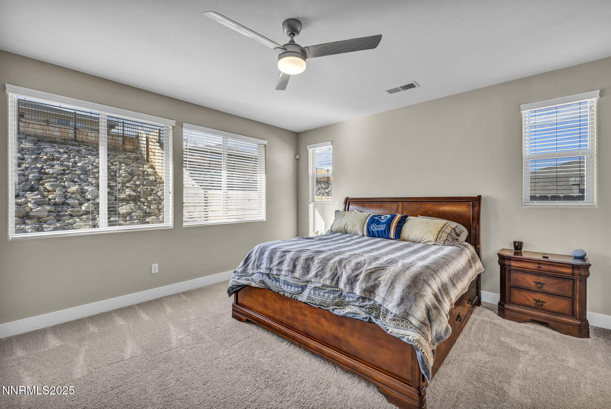 32 Stellar Court Carson City, NV 89705 - Photo 18 of 49 a bedroom with a bed a chandelier and a large window