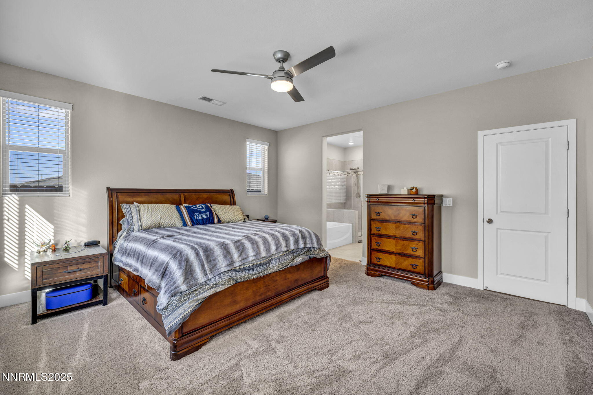 32 Stellar Court Carson City, NV 89705 - Photo 19 of 49 a bedroom with a bed and a ceiling fan