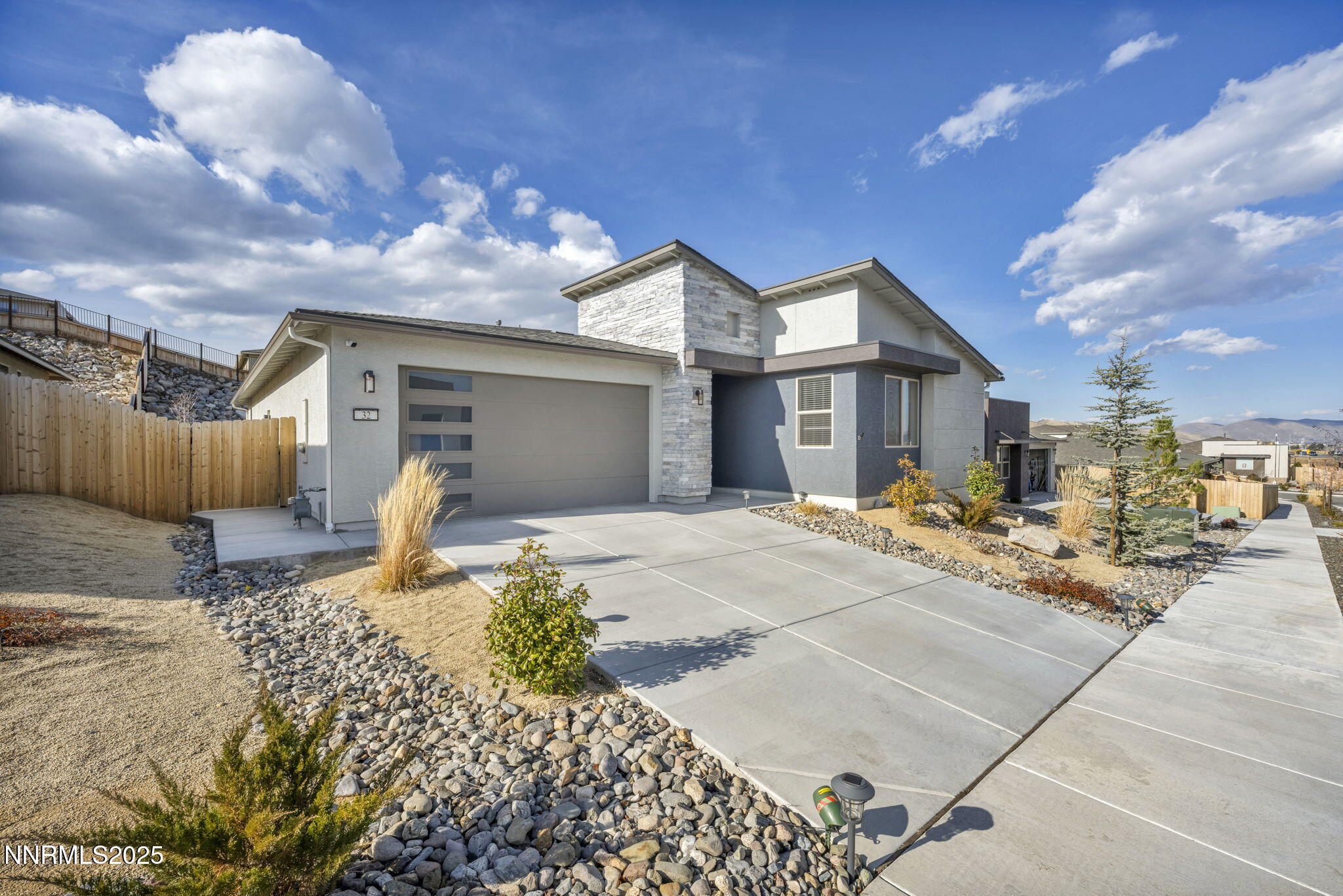 32 Stellar Court Carson City, NV 89705 - Photo 2 of 49 a front view of a house with a yard outdoor seating and covered with outer view