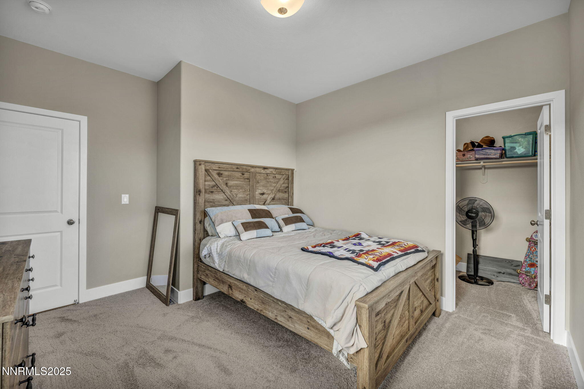 32 Stellar Court Carson City, NV 89705 - Photo 24 of 49 a bedroom with a bed and a table in it