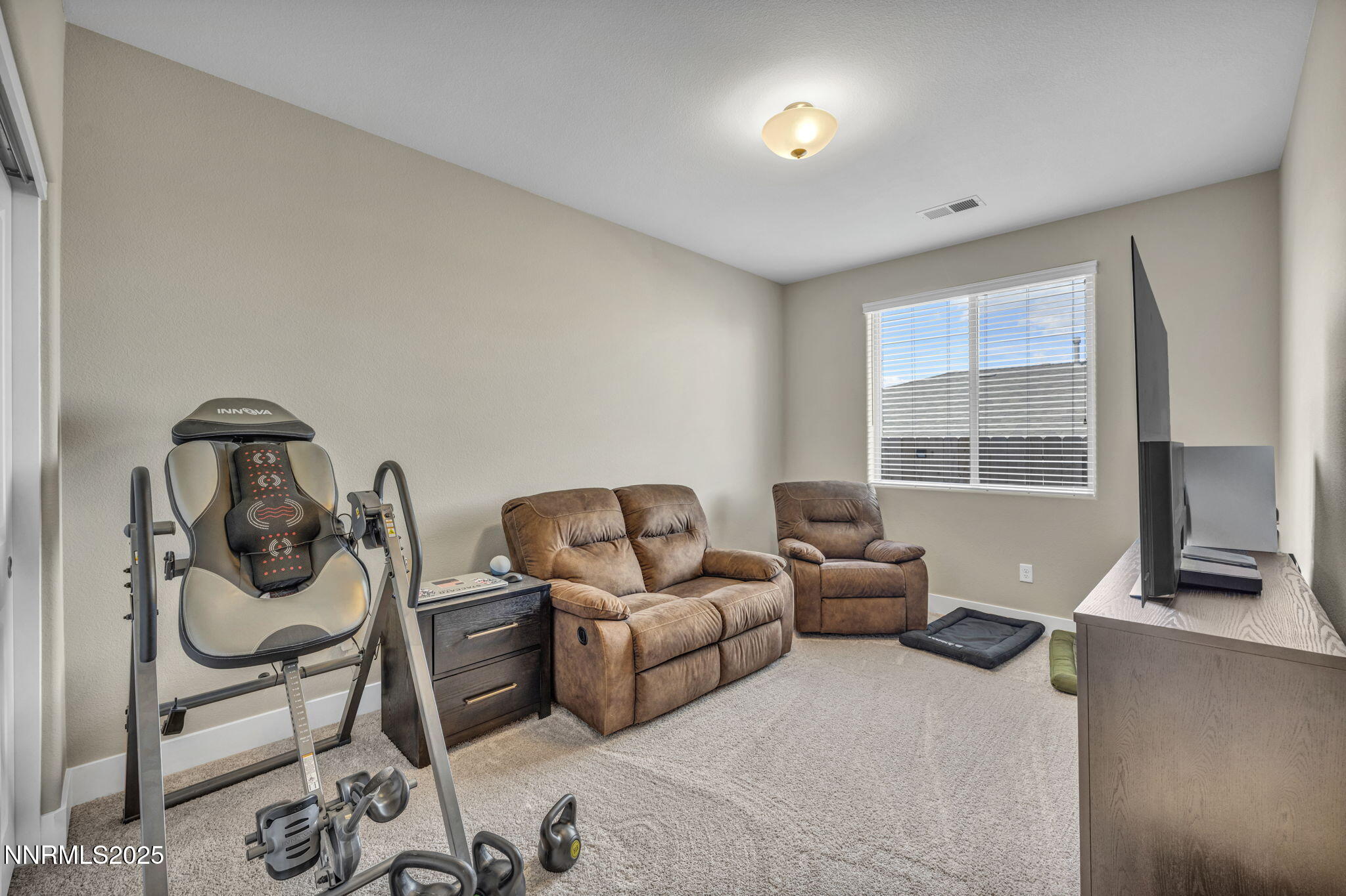 32 Stellar Court Carson City, NV 89705 - Photo 26 of 49 a living room with furniture a flat screen tv and a window