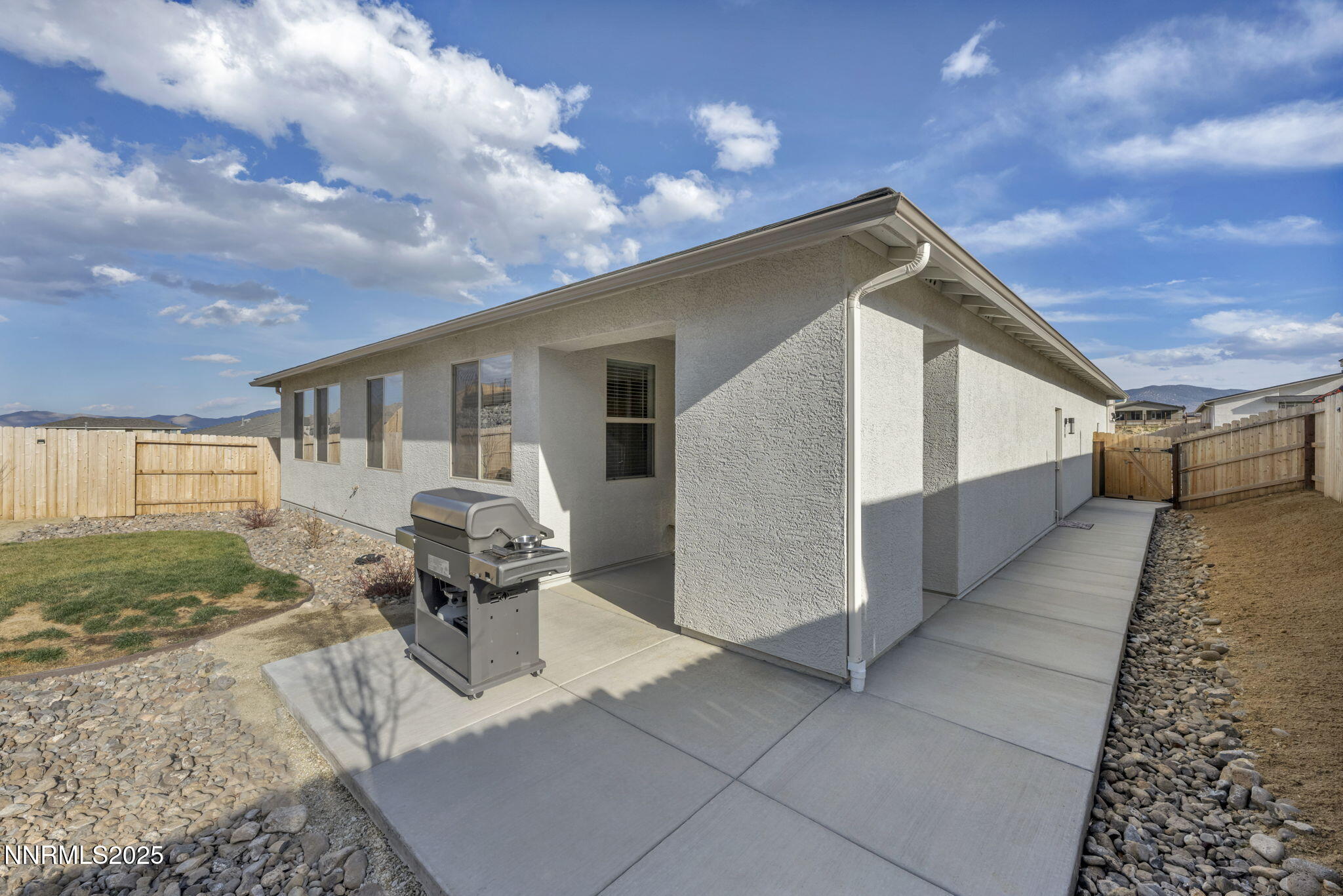32 Stellar Court Carson City, NV 89705 - Photo 38 of 49 a roof deck with table and chairs and potted plants