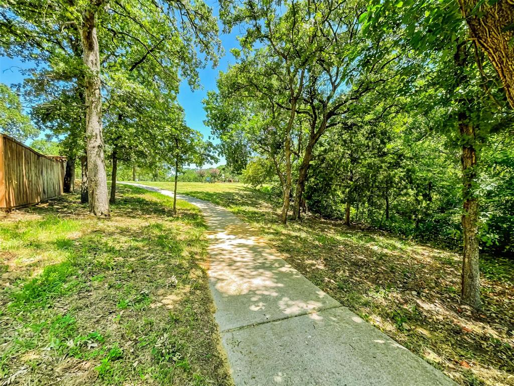 3100 Ashwood Lane Corinth, TX 76210 - Photo 4 of 8 a view of a yard with a tree