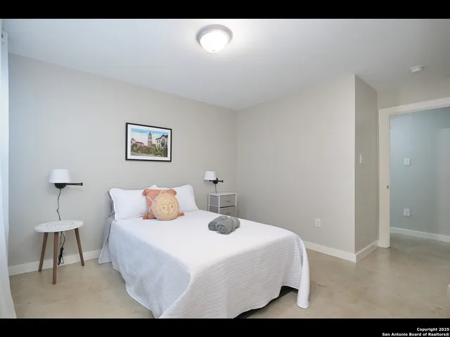 a bed room with a bed and a window