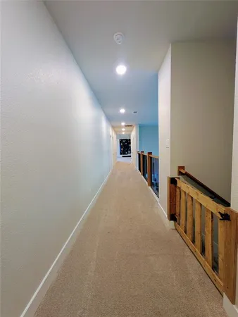 a view of hallway with stairs