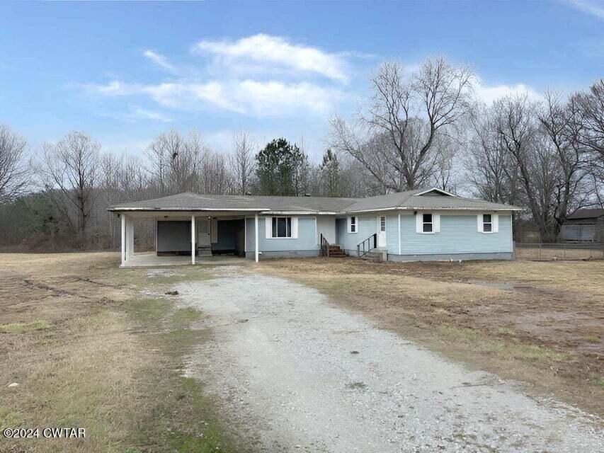 1759 Janes Mill Road Gleason, TN 38229 - Photo 1 of 18 a front view of house with yard space and trees around