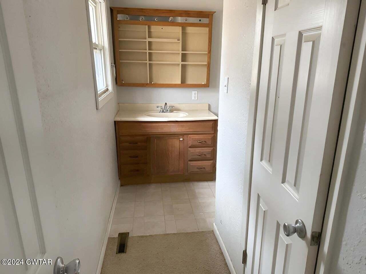 1759 Janes Mill Road Gleason, TN 38229 - Photo 14 of 18 a bathroom with a sink