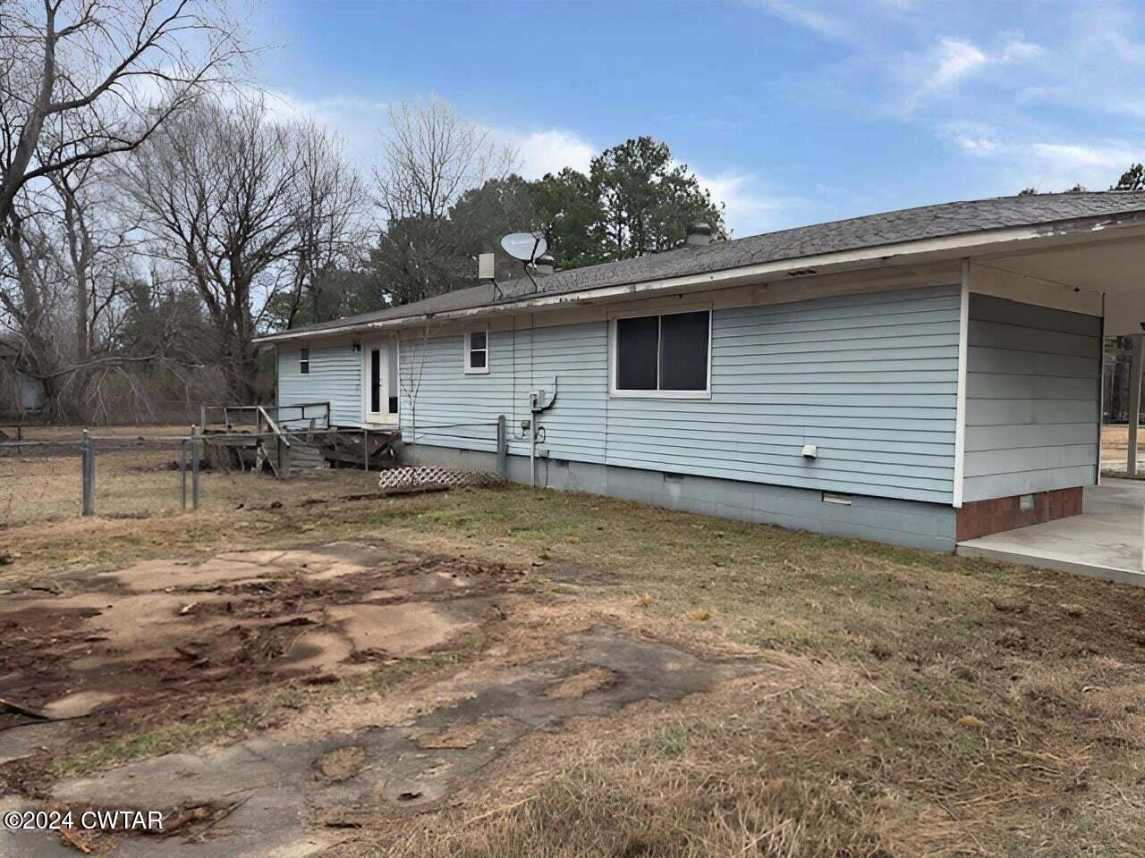 1759 Janes Mill Road Gleason, TN 38229 - Photo 3 of 18 a backyard of a house with table and chairs