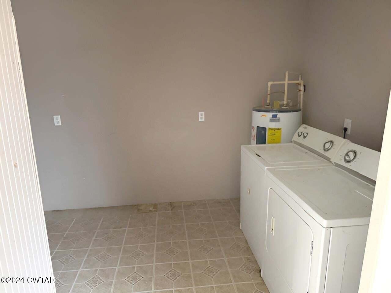 1759 Janes Mill Road Gleason, TN 38229 - Photo 8 of 18 a utility room with dryer and washer