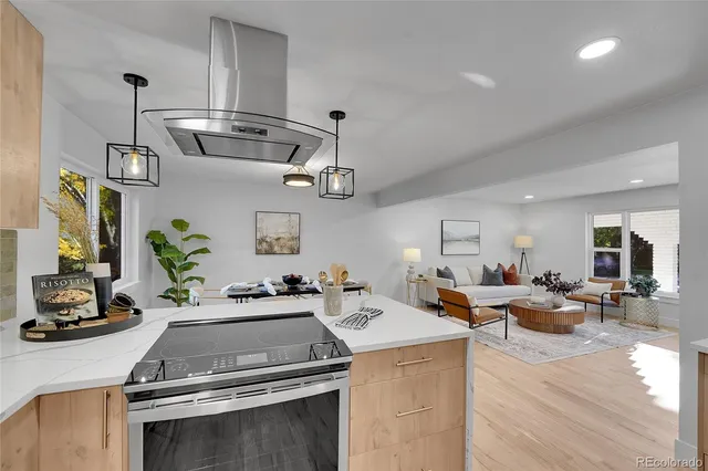 a kitchen with a sink appliances and cabinets