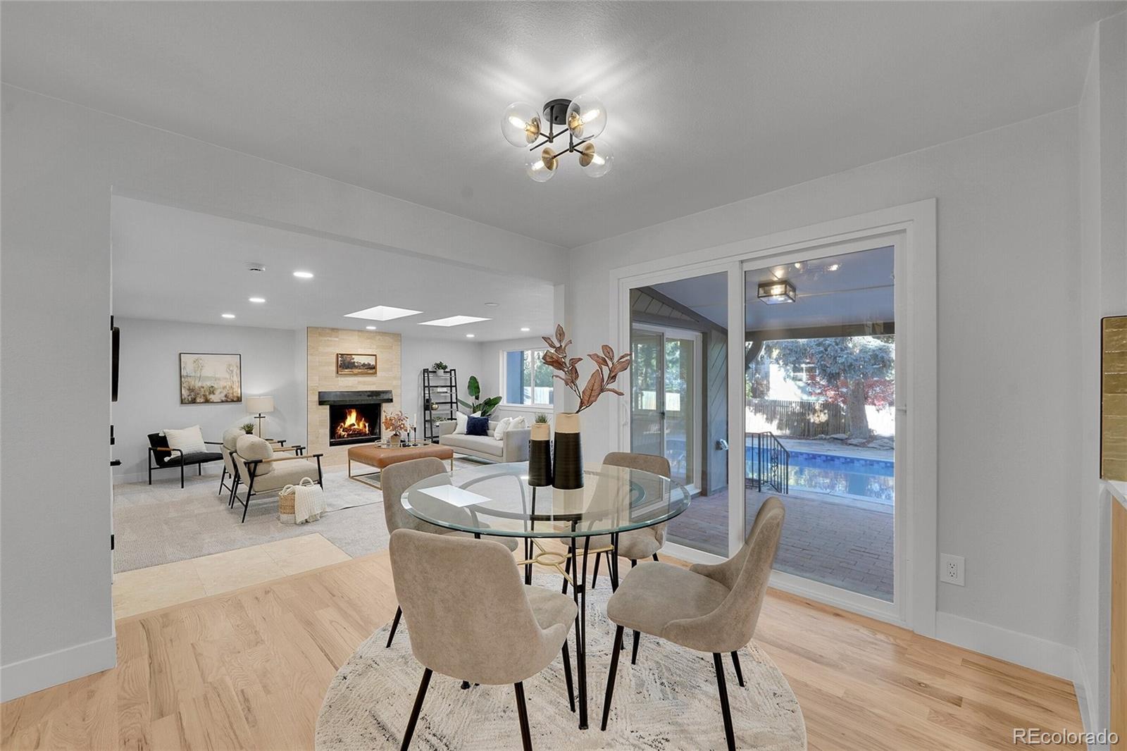 3261 South Oneida Way Denver, CO 80224 - Photo 13 of 43 a view of a dining room with furniture window and outside view