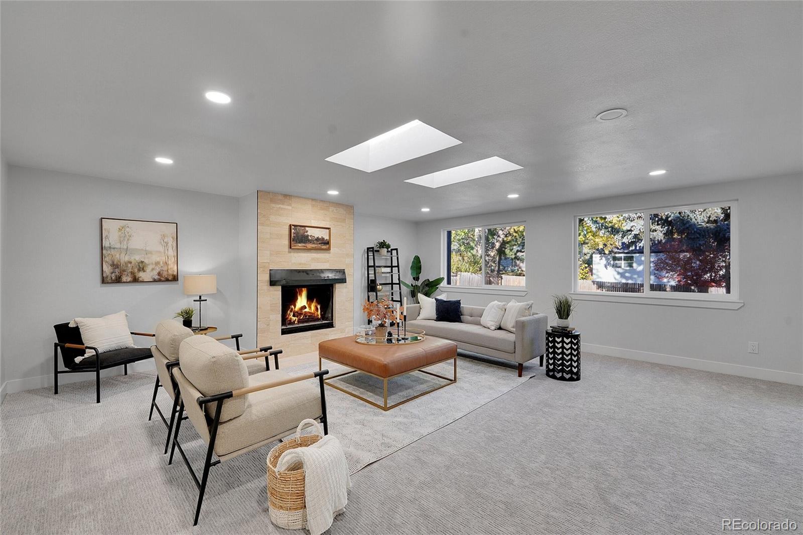 3261 South Oneida Way Denver, CO 80224 - Photo 14 of 43 a living room with furniture and a fireplace