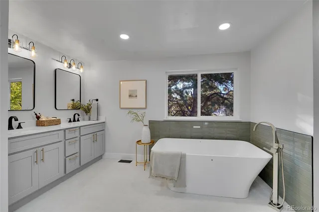 a spacious bedroom with a bed and a window