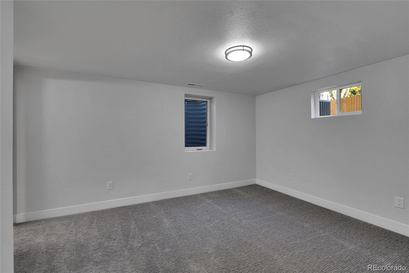 3261 South Oneida Way Denver, CO 80224 - Photo 28 of 43 an empty room with windows