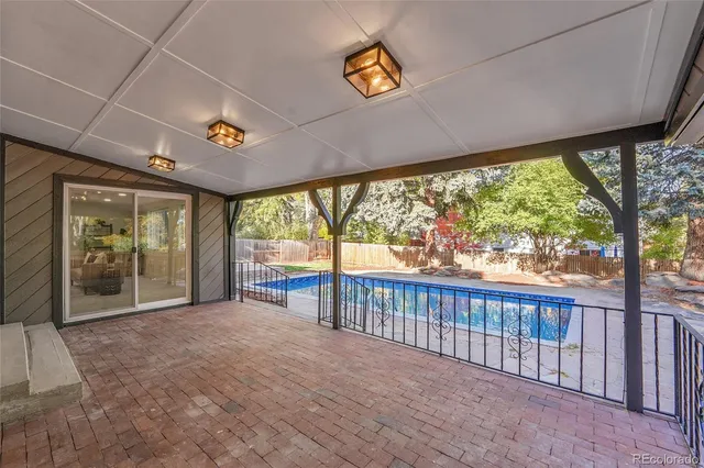 a view of a porch with wooden floor and roof