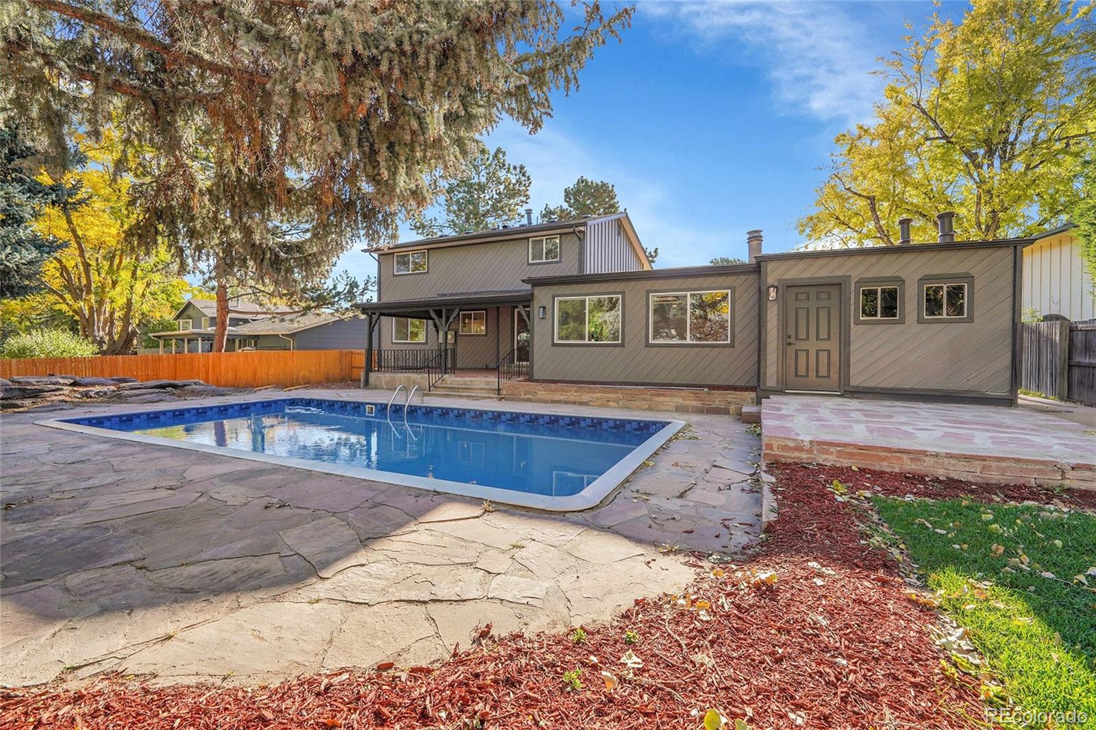 3261 South Oneida Way Denver, CO 80224 - Photo 34 of 43 a view of a house with a yard