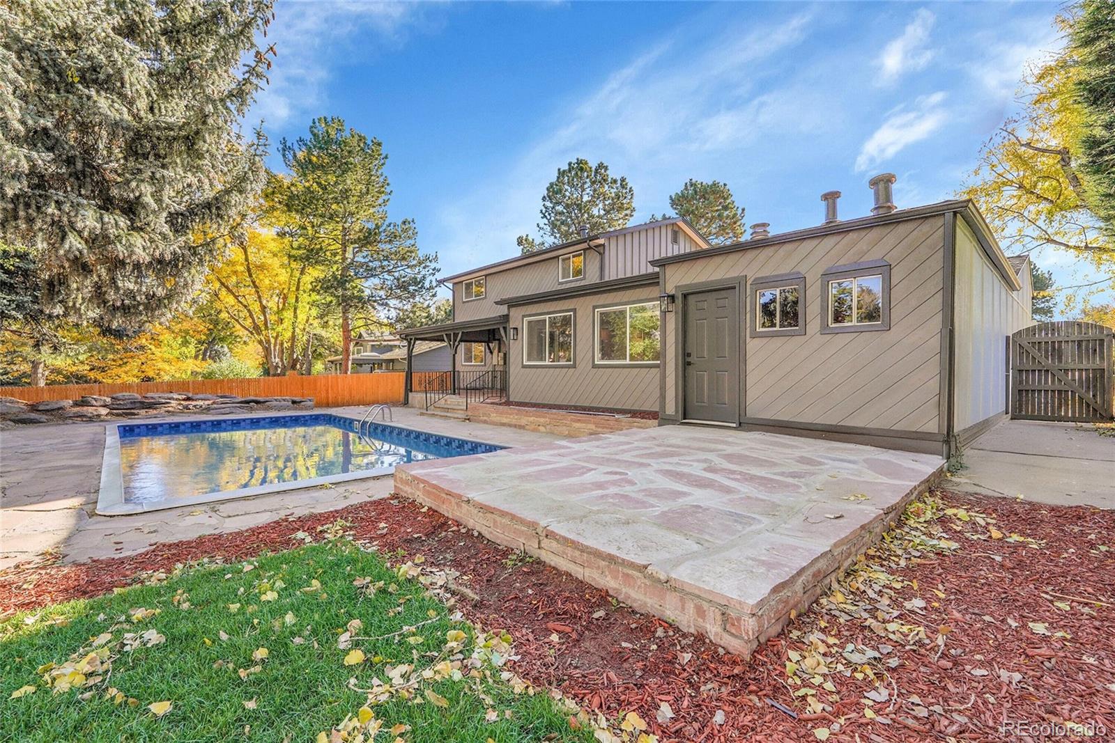 3261 South Oneida Way Denver, CO 80224 - Photo 35 of 43 a view of a house with a yard