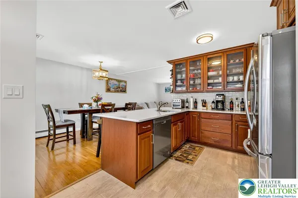 a kitchen with stainless steel appliances granite countertop a stove and a refrigerator