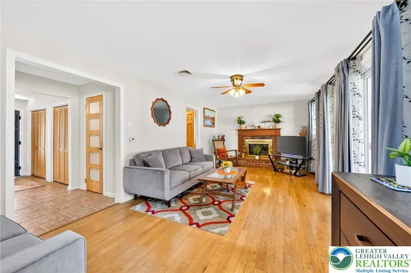 a living room with furniture and a fireplace