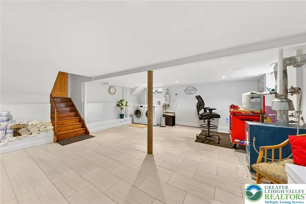 a view of livingroom with furniture and rug
