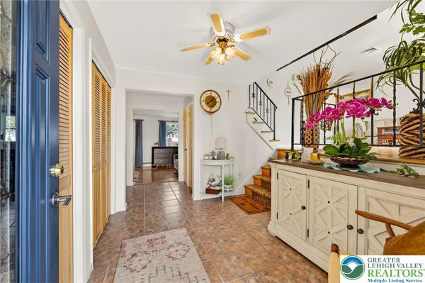a view of entryway dining room and hall with wooden floor