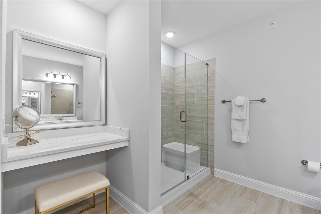 651 Watters Road, Unit 4403 Allen, TX 75013 - Photo 20 of 37 a bathroom with a shower sink and mirror