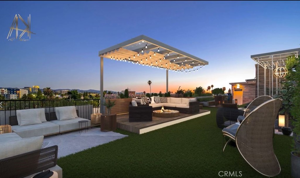 an outdoor living room with furniture and a floor to ceiling window