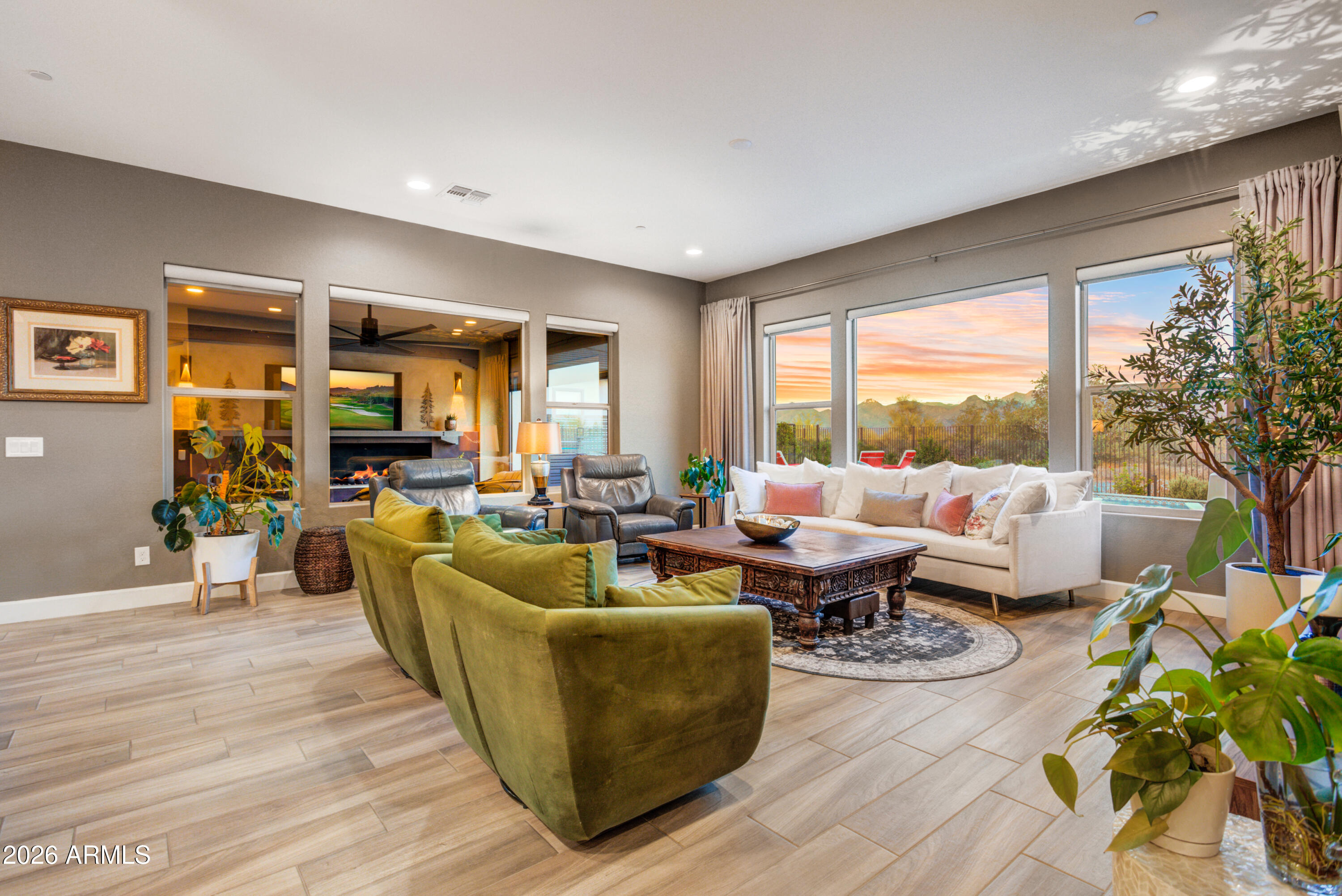 28517 North Camel Rock Court Rio Verde, AZ 85263 - Photo 13 of 39 a living room with furniture large windows and wooden floor
