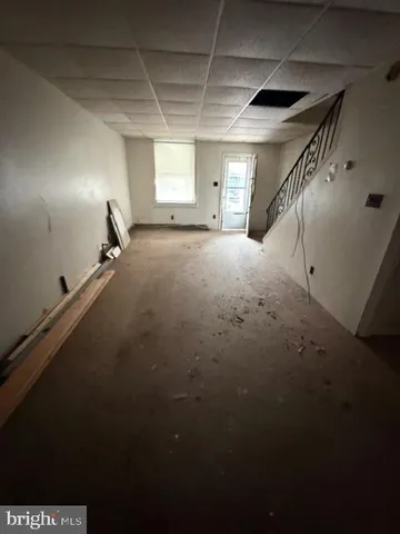a bathroom with a toilet a sink and a mirror