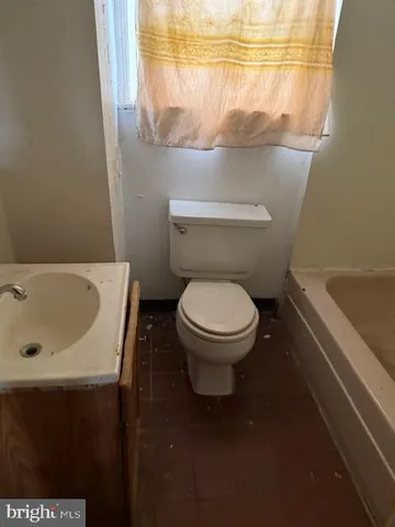 an empty room with a bench