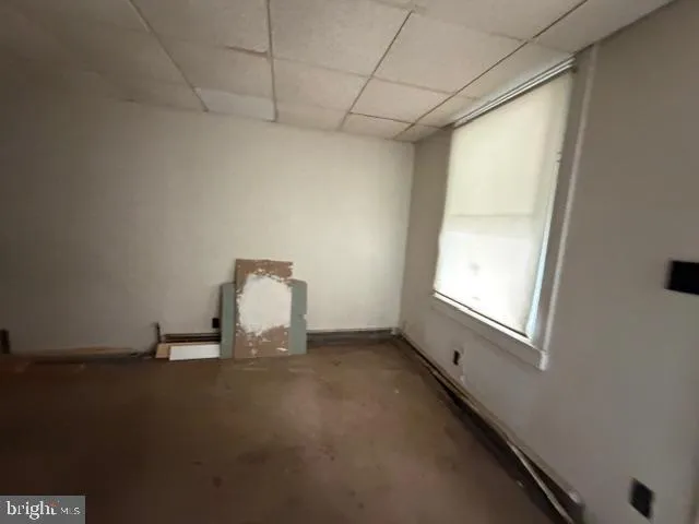 a bathroom with a shower and a mirror