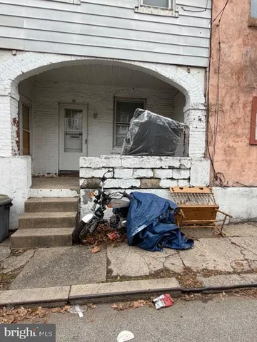 a view of a two chair and table in the balcony