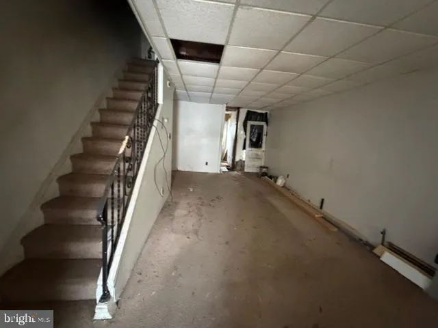 a kitchen with a refrigerator and a washer