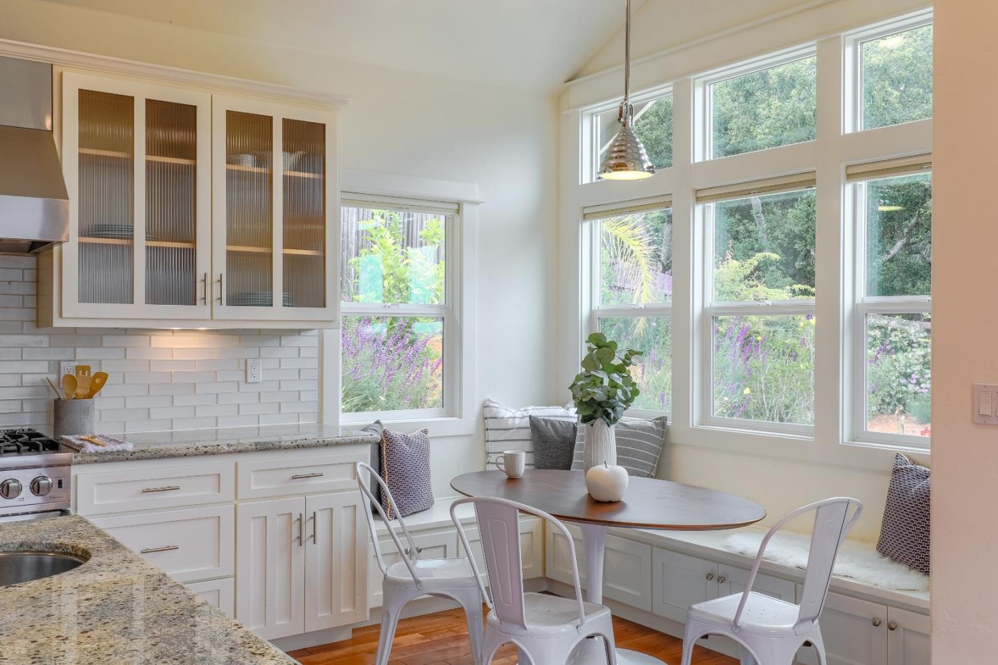 3030 Haas Drive Aptos, CA 95003 - Photo 13 of 44 a dining room with furniture large windows and wooden floor