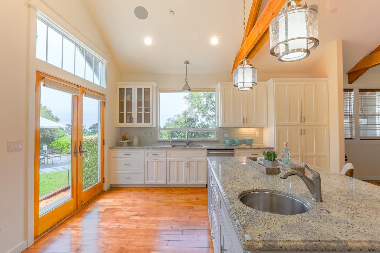 3030 Haas Drive Aptos, CA 95003 - Photo 14 of 44 a large kitchen with kitchen island a large window a sink and stainless steel appliances