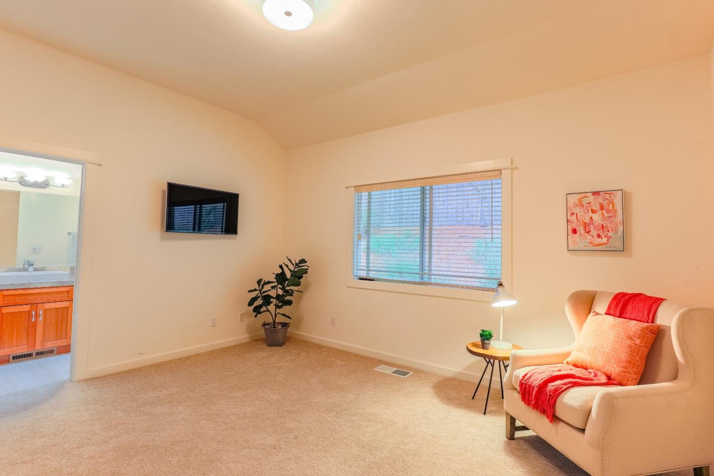 3030 Haas Drive Aptos, CA 95003 - Photo 24 of 44 a bedroom with furniture and a potted plant