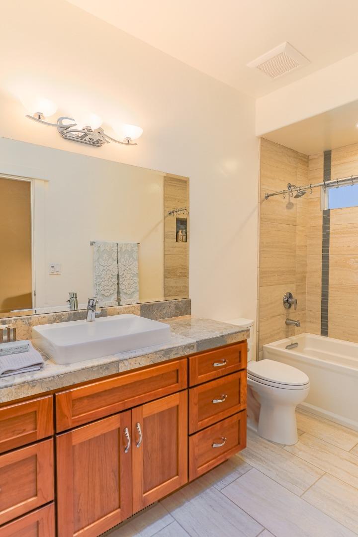 3030 Haas Drive Aptos, CA 95003 - Photo 25 of 44 a bathroom with a granite countertop sink and a mirror