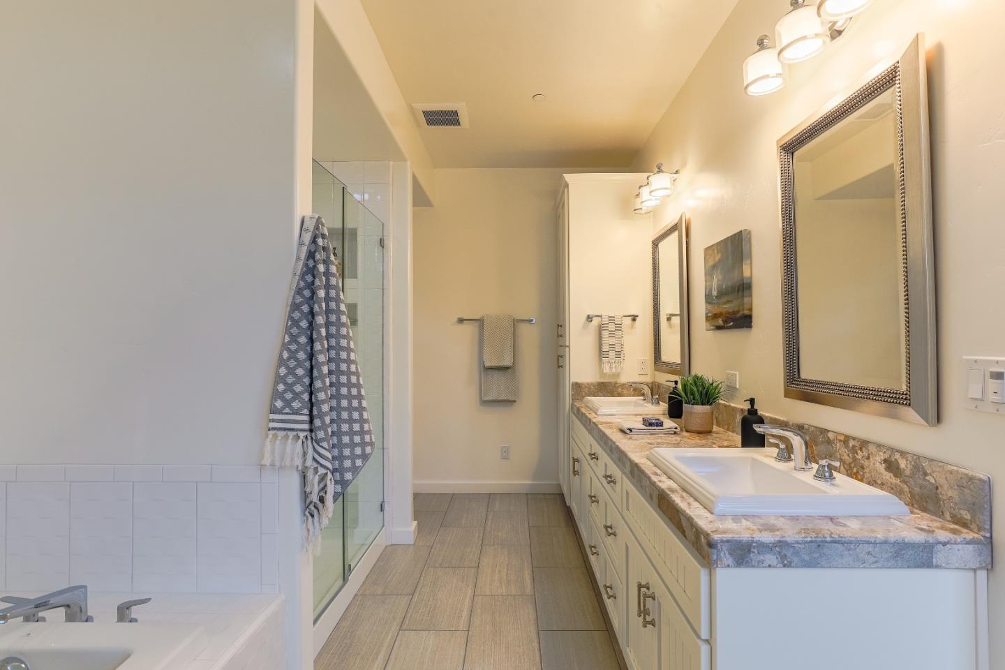 3030 Haas Drive Aptos, CA 95003 - Photo 29 of 44 a bathroom with a granite countertop sink and a mirror