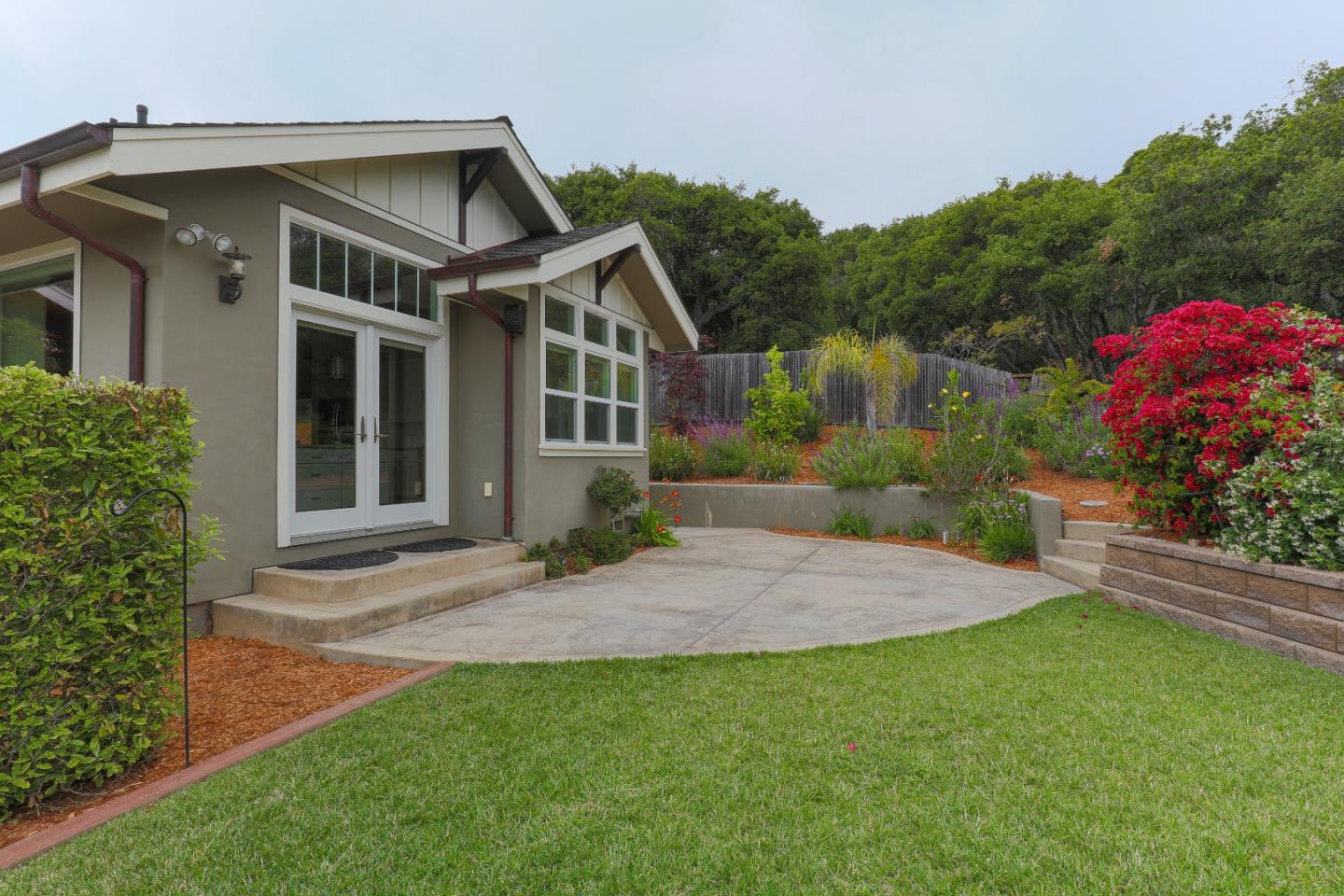 3030 Haas Drive Aptos, CA 95003 - Photo 43 of 44 a front view of a house with a garden and plants