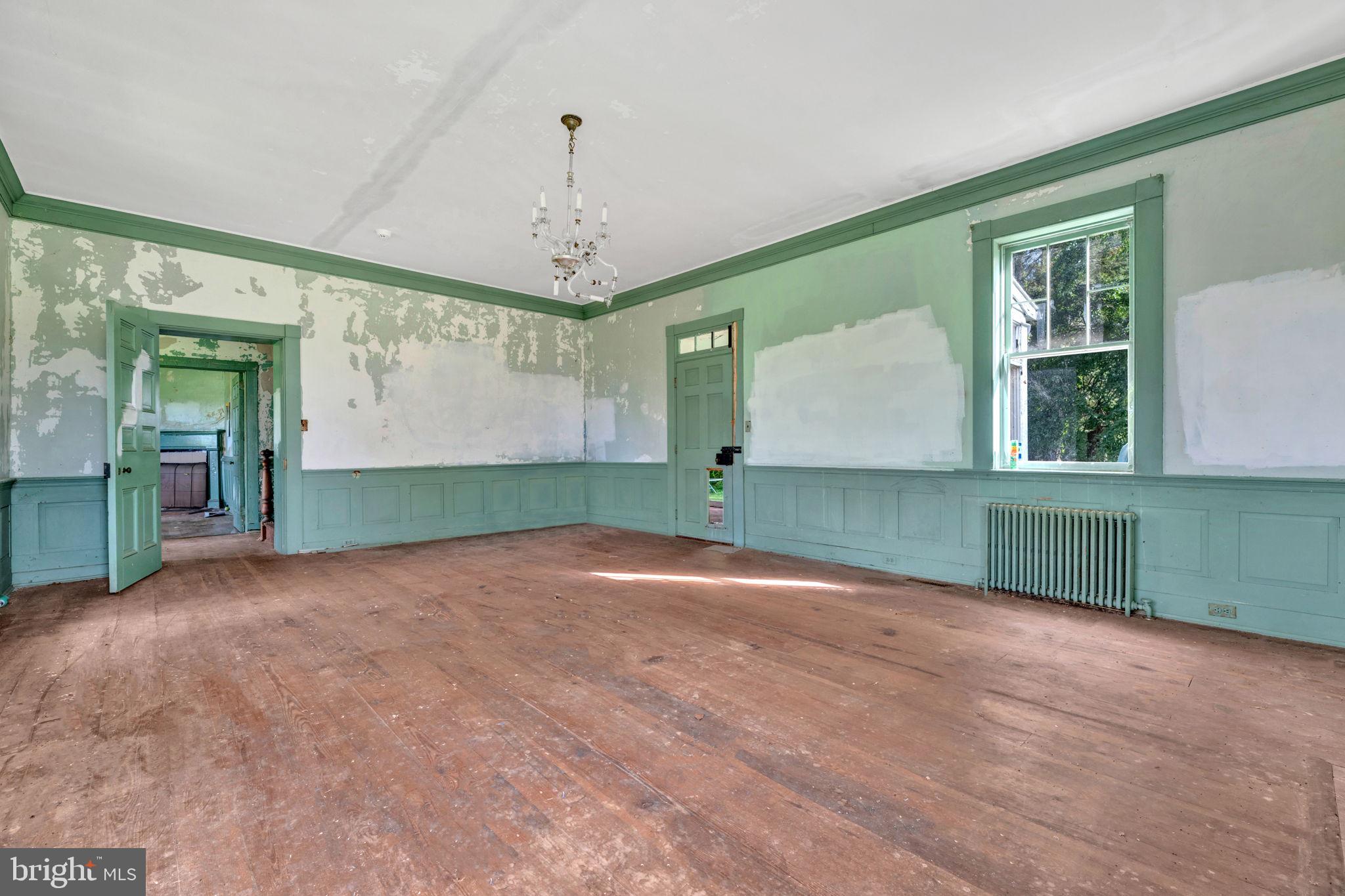 2173 Johns Hopkins Road Gambrills, MD 21054 - Photo 13 of 18 a view of empty room with a window and fireplace