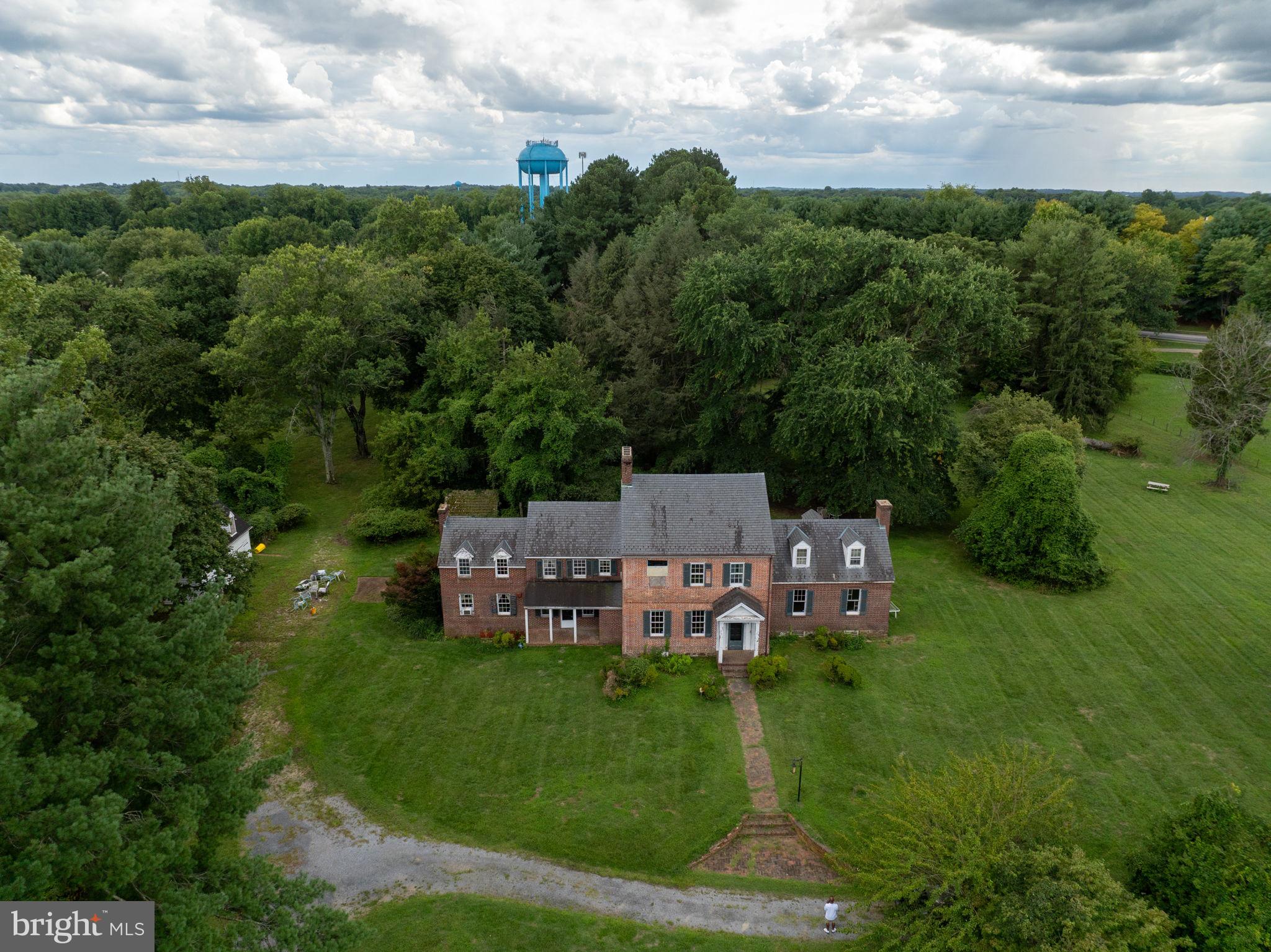 2173 Johns Hopkins Road Gambrills, MD 21054 - Photo 3 of 18 a view of a chairs in a big yard