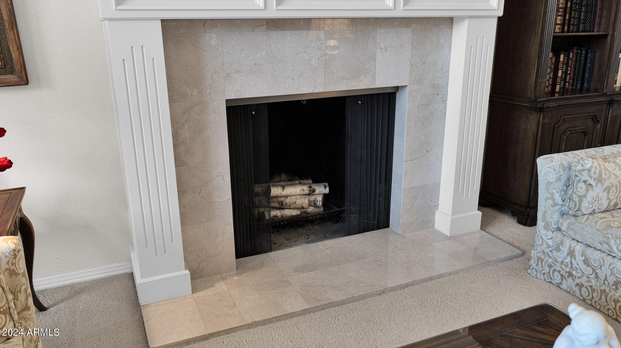 7878 East Gainey Ranch Road, Unit 49 Scottsdale, AZ 85258 - Photo 8 of 42 LIng room fireplace